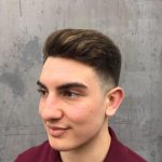 A man with short hair and a beard.