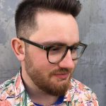 A man with glasses and a beard