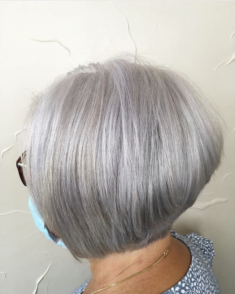 A woman with short hair is wearing glasses.